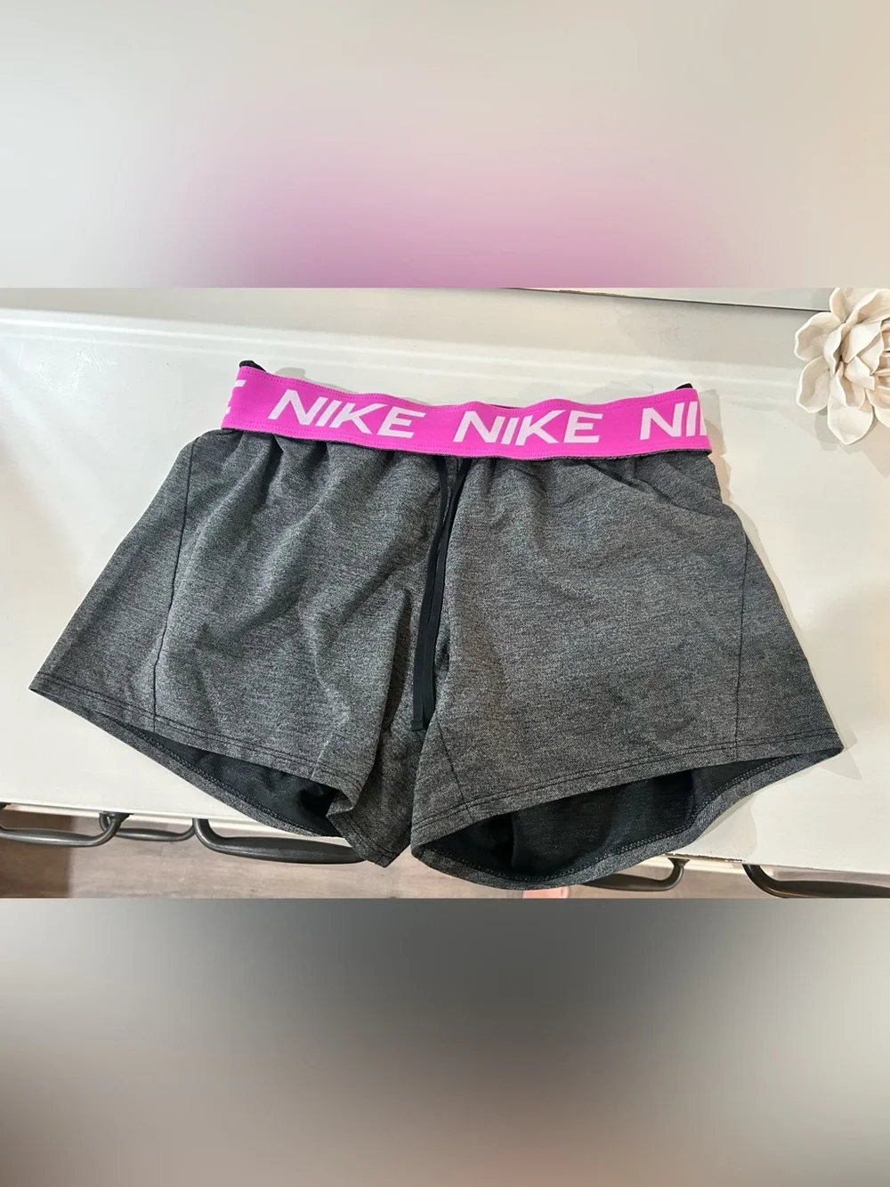 Nike Women's Gray Athletic Shorts with Pink Logo Waistband